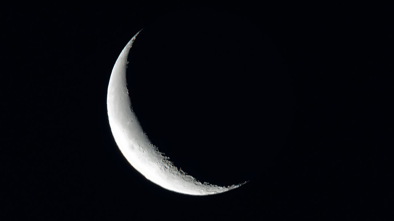 Image of a waning crescent moon with a calm, reflective feel